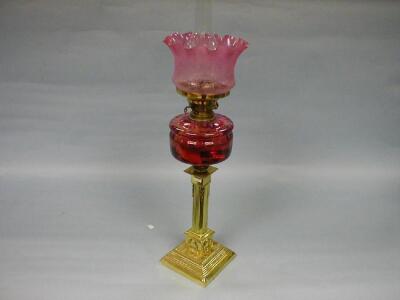 A Victorian brass column oil lamp