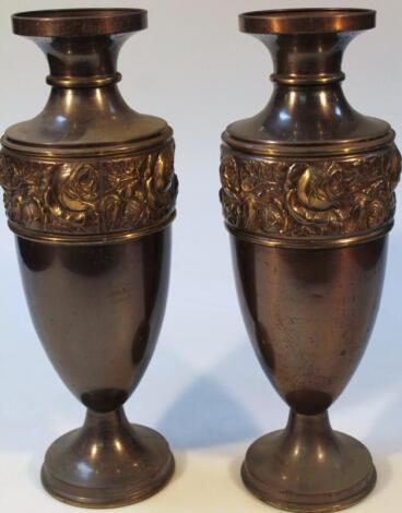 A pair of metal classical design vases