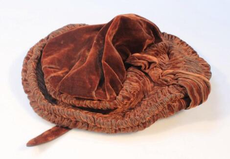 A 19thC brown velvet bonnet