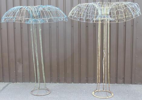 A near matching pair of Victorian wirework garden shades