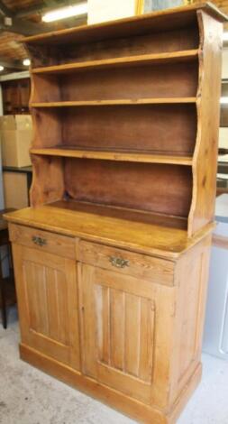 A rustic pine kitchen dresser