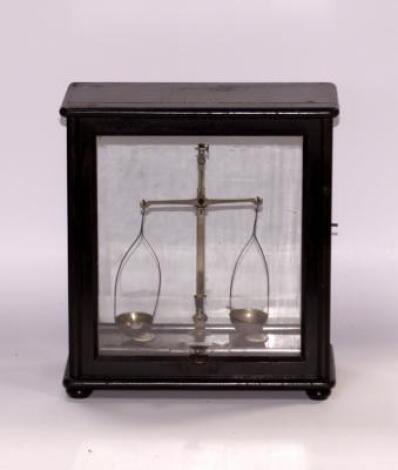 A set of early 20thC ebonised chemist scales