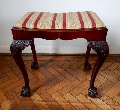 A Chippendale style mahogany dressing stool.