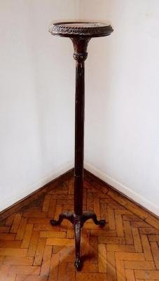 A mahogany torchere with circular platform and tripod base. 162cm high.