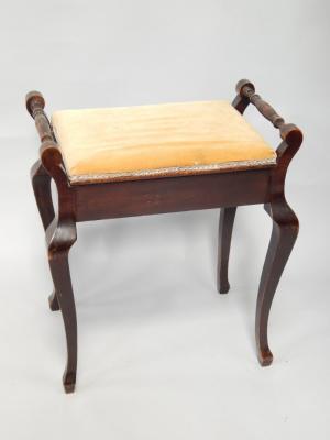 A mahogany piano stool