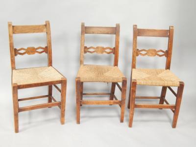 A set of three 19thC rush seated elm chairs.