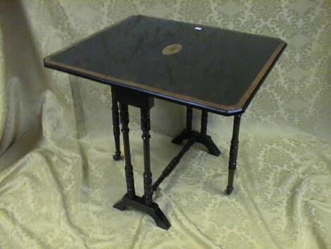 An Edwardian stained beech Sutherland table