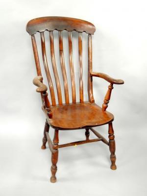 A Victorian beech lath back open armchair