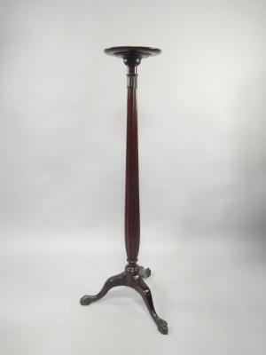 A mahogany torchere