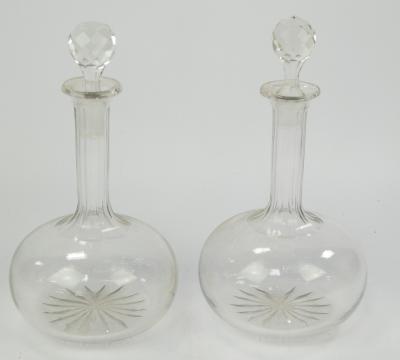 A pair of cut glass decanters