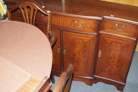 A Strongbow reproduction mahogany dining room suite