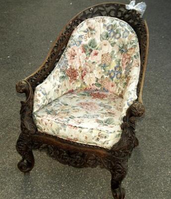 An Anglo Indian carved hardwood bergere chair