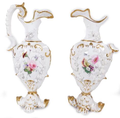 A pair of mid 19thC Rockingham porcelain ewers