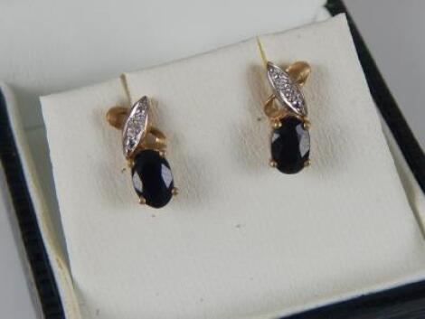 A pair of 9ct gold earrings