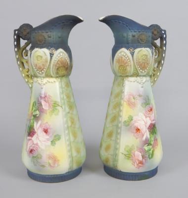 A pair of Austrian Art Nouveau style ceramic ewers