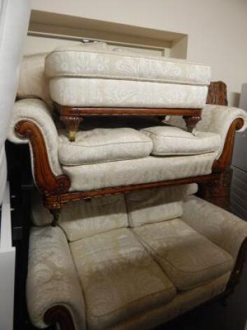 A pair of modern upholstered Victorian style two seat sofas