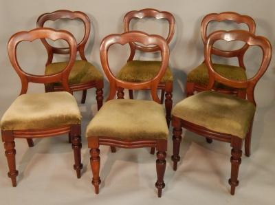 A set of six Victorian walnut balloon back dining chairs