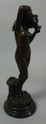 A bronze figure of a nude water carrier