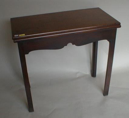 A George III mahogany tea table with rectangle folding top