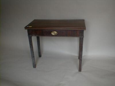 A George III mahogany card table with moulded rectangle folding top