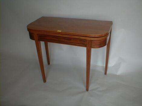 A George III flamed mahogany tea table with rounded rectangular folding