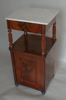 A Victorian flamed mahogany night table with marble top