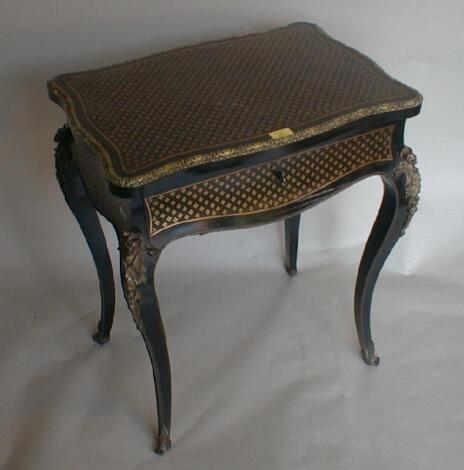 A mid 19thC brass and rosewood inlaid work table of serpentine form with lift top