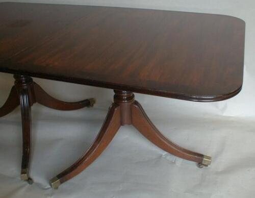 A Regency style mahogany twin pillar dining table. 3ft 6 ins wide