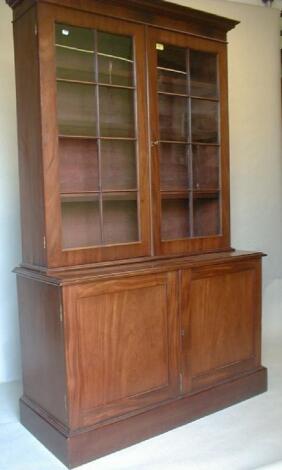 A Victorian mahogany cabinet bookcase with later moulded cornice