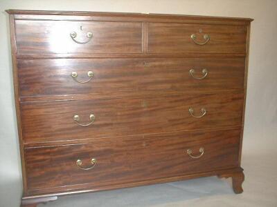 A George III mahogany chest of two short and three long graduated drawers