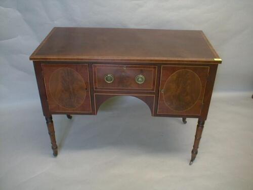 A 19thC flamed mahogany side table on turned legs and having centre drawer