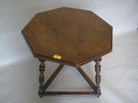 A Victorian oak gypsy table with moulded octagonal top