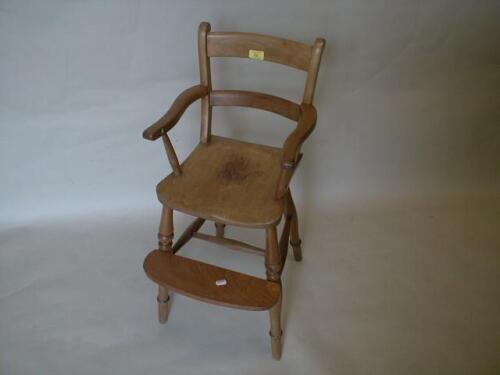 A Victorian ash and elm child's high chair with barback