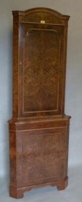 A Queen Anne style walnut corner cupboard with burr quarter veneered door