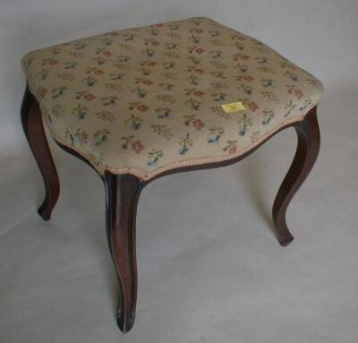 A Victorian mahogany stool of serpentine form with moulded cabriole legs (one AF)