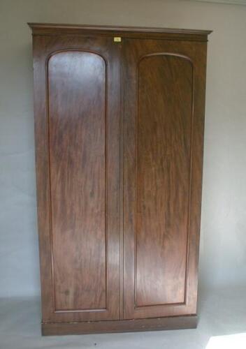 A Victorian mahogany double wardrobe with moulded cornice