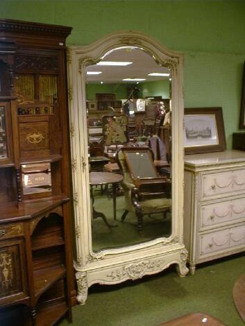 A Louis XV style painted armoire with single arched mirror door with bevelled