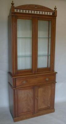 A late Victorian walnut secretaire bookcase with stratch carved and galleried