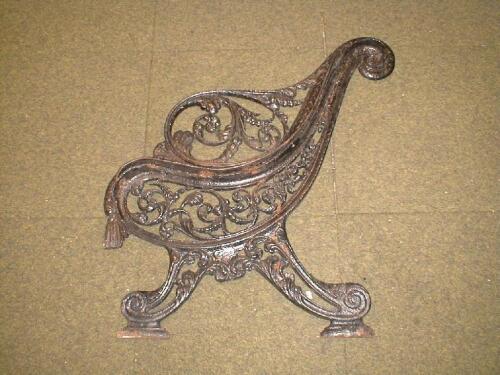 A pair of 19thC Coalbrookdale cast iron garden bench ends