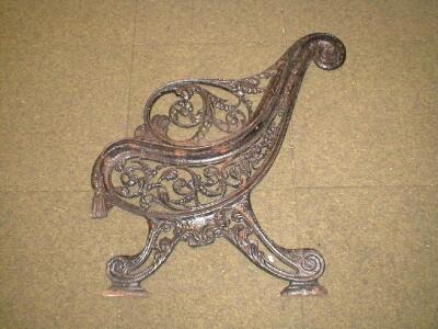 A pair of 19thC Coalbrookdale cast iron garden bench ends