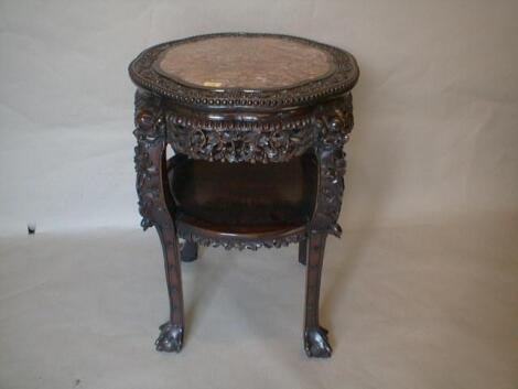 A 19thC carved hardwood jardiniere stand with shaped marble inset top