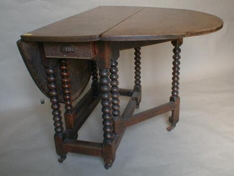 A 17thC oak gateleg table with oval top