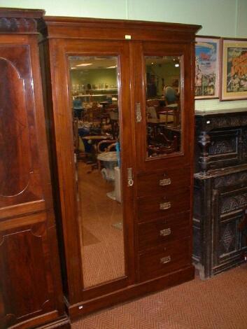 A late Victorian walnut wardrobe compactum with single mirror door