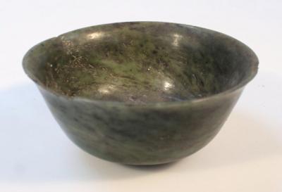 A Chinese olive green jade bowl