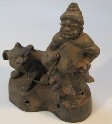 An unusual oriental cast metal figure group