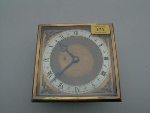 A Canterbury gilt brass table clock with silver chapter ring and Roman numerals 6" square