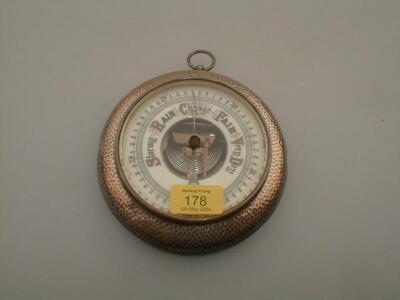 An Edwardian silver and oak cased aneroid barometer of Goliath pocket watch form