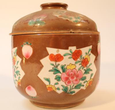 A Chinese porcelain brown glaze jar and cover