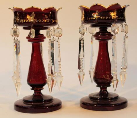 A pair of late 19thC ruby glass lustres