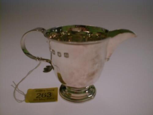 A George V silver cream jug by Thomas Bradley & Sons